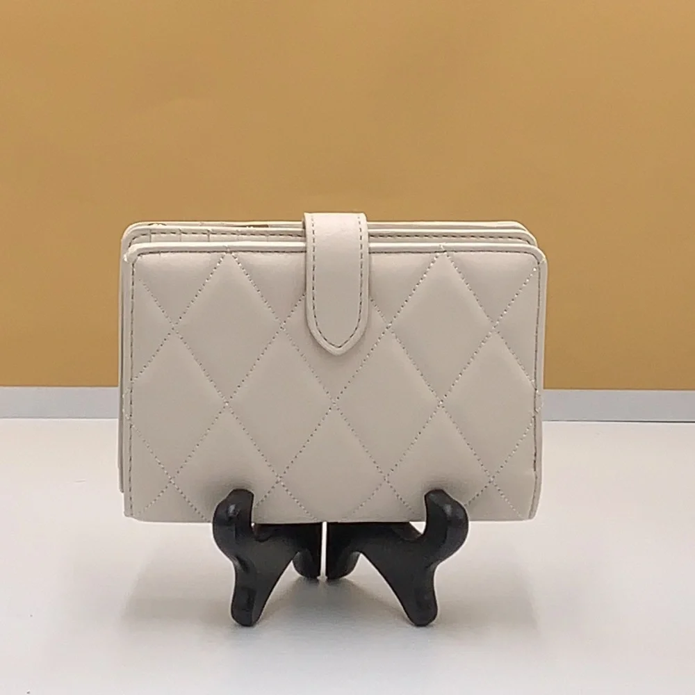 KATE SPADE Carey Medium Compact Bifold Wallet Parchment Color
